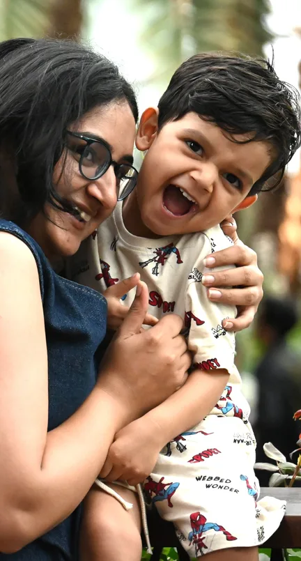 Mother embracing her laughing child